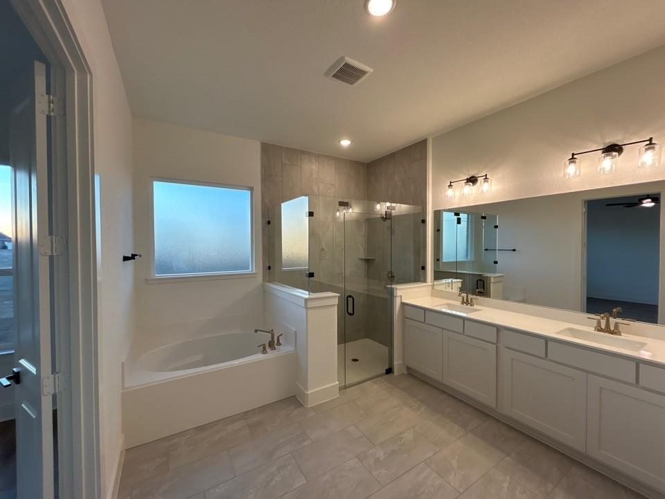 810 Vly Rdg Road Van Alstyne, TX 75495 - Photo 7 of 13 a bathroom with a tub sink shower and mirror