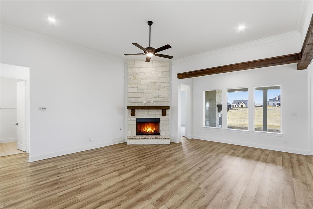810 Vly Rdg Road Van Alstyne, TX 75495 - Photo 8 of 39 an empty room with windows and fireplace
