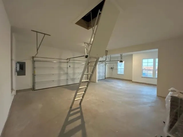 a bathroom with a tub sink shower and mirror