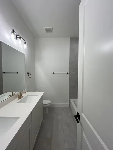 a view of a room with rack and a window