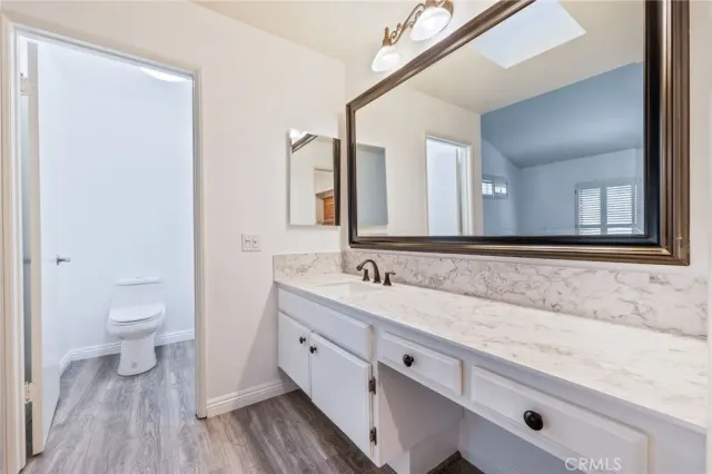 a bathroom with a toilet and a bathtub
