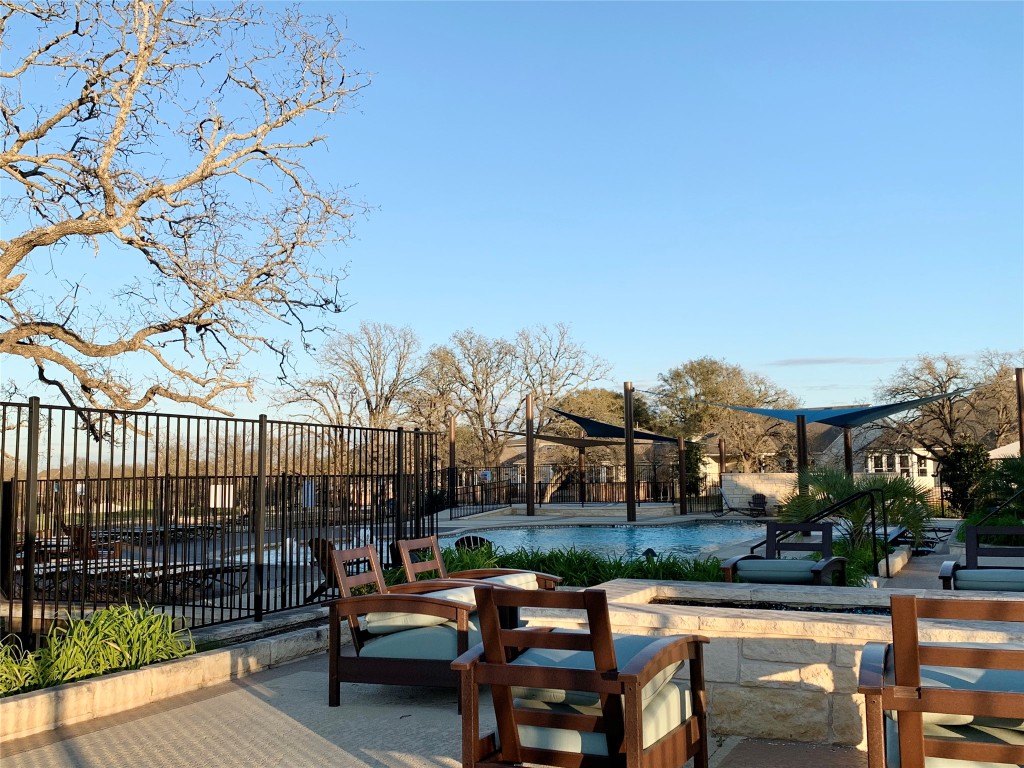 265 Falling Star Lane Georgetown, TX 78628 - Photo 19 of 22 a patio with glass top table and chairs