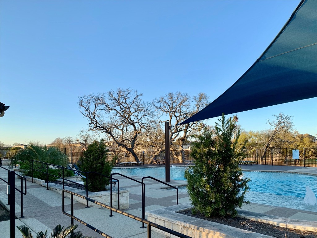 265 Falling Star Lane Georgetown, TX 78628 - Photo 20 of 22 a view of a bench in a backyard