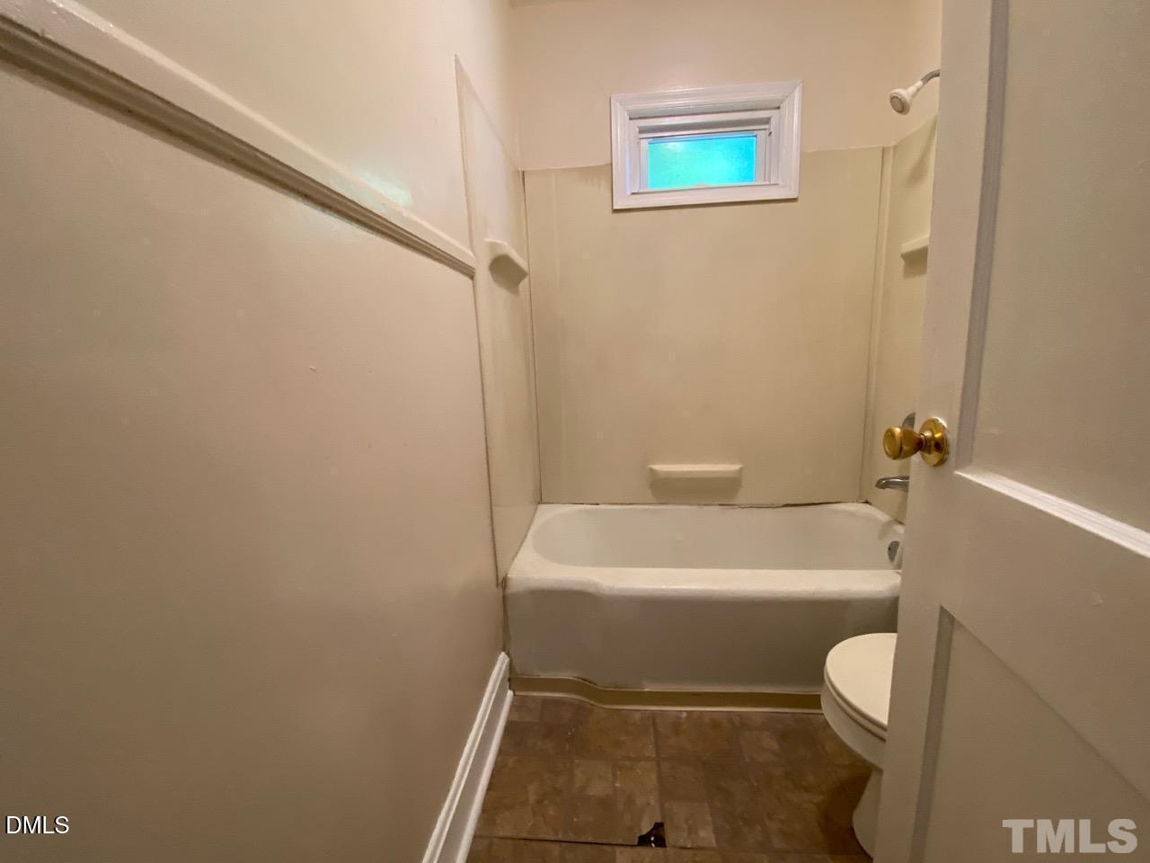 907 Bunn Terrace Durham, NC 27703 - Photo 8 of 8 a white toilet sitting next to a white sink