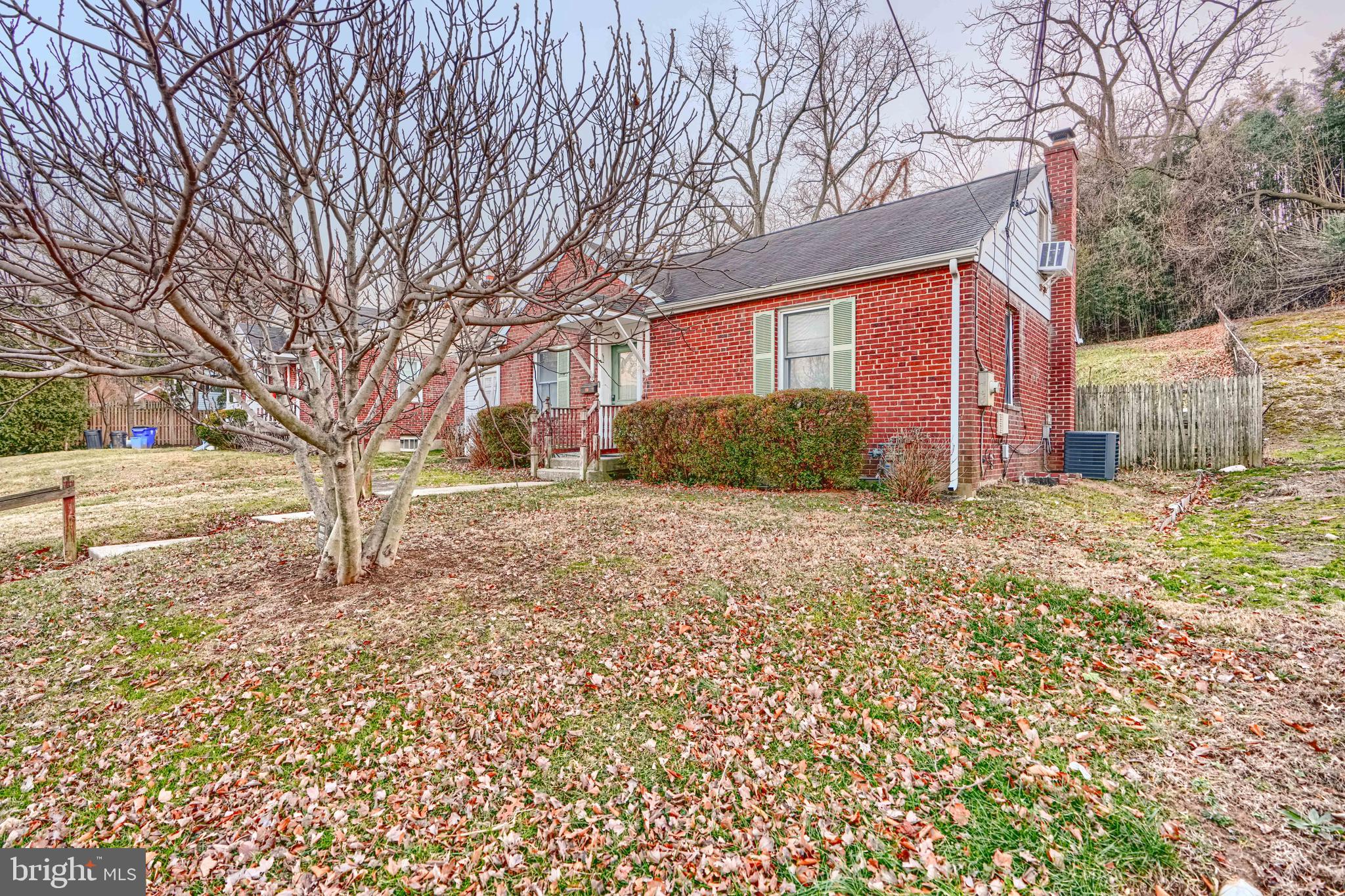 2704 Fenimore Road Silver Spring, MD 20902 - Photo 3 of 9 a front view of a house with a yard