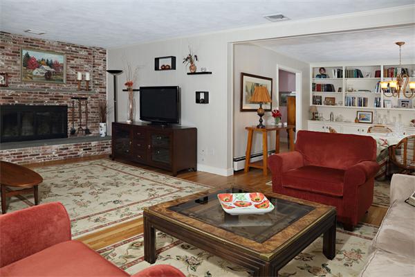 12 Falmouth Road Wellesley, MA 02481 - Photo 4 of 8 a living room with furniture and a flat screen tv
