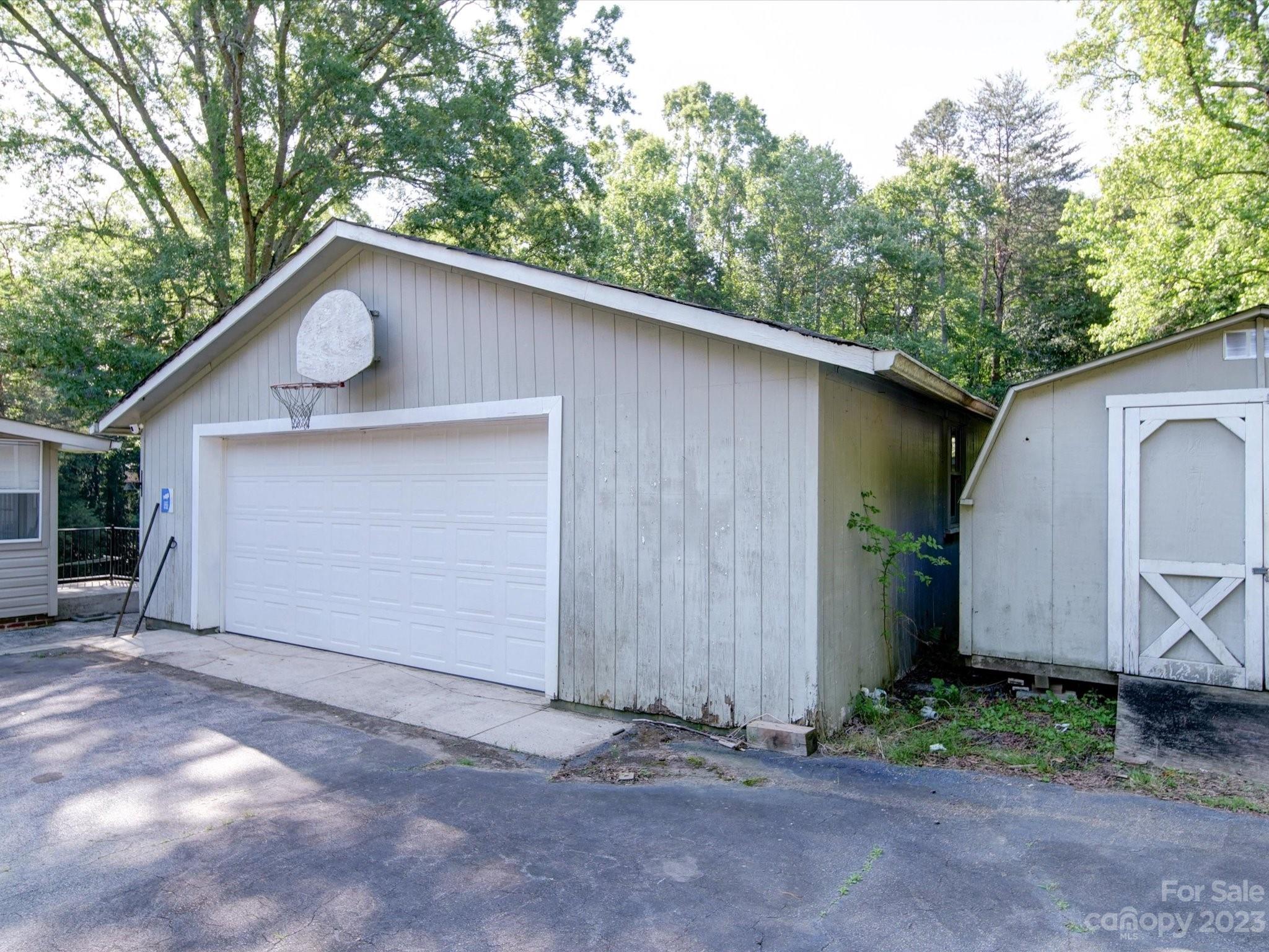 3938 Tater Ridge Road Concord, NC 28025 - Photo 14 of 23 a view of a house with a yard plants and large tree