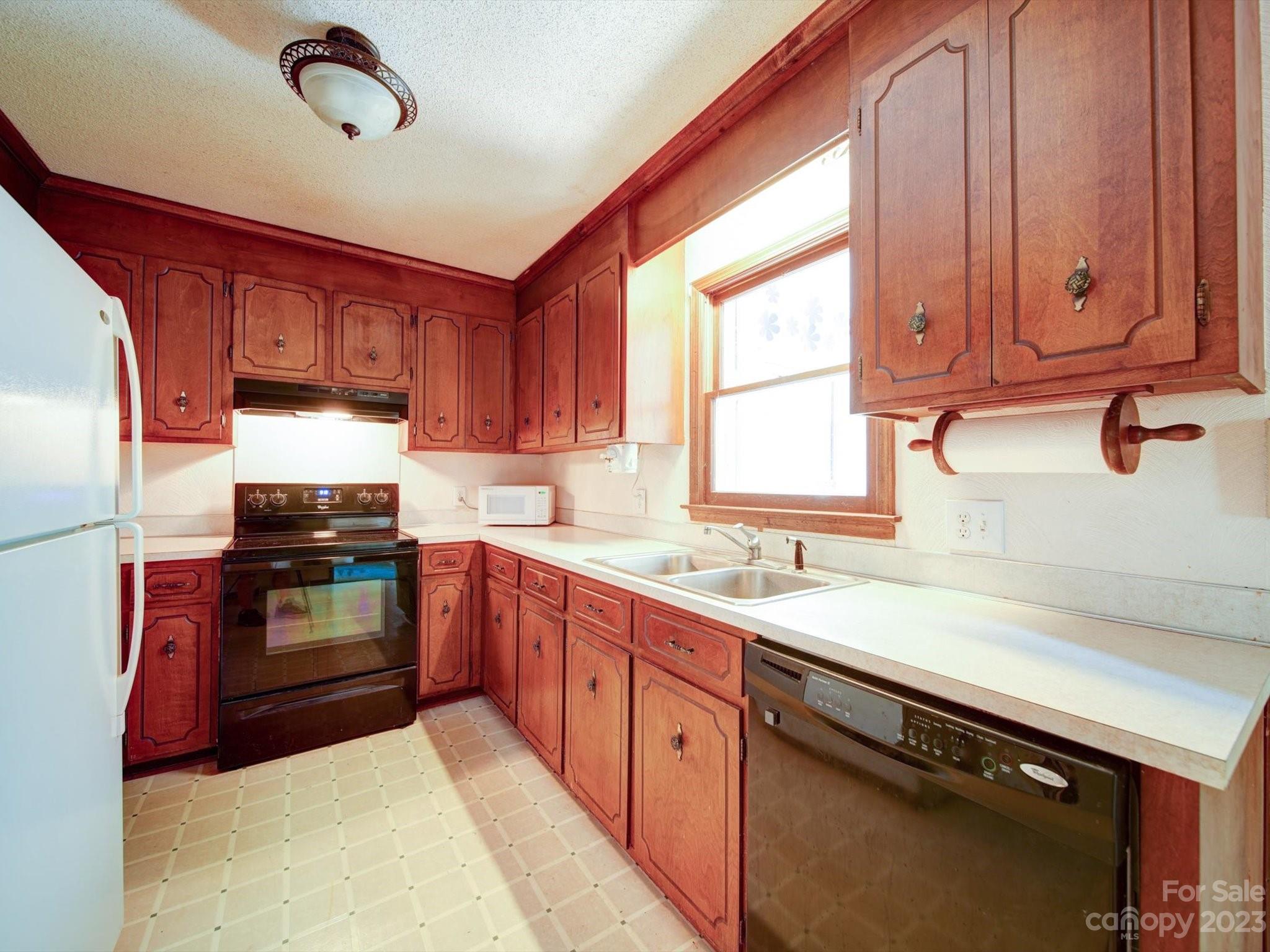 3938 Tater Ridge Road Concord, NC 28025 - Photo 5 of 23 a kitchen with granite countertop a stove sink and cabinets