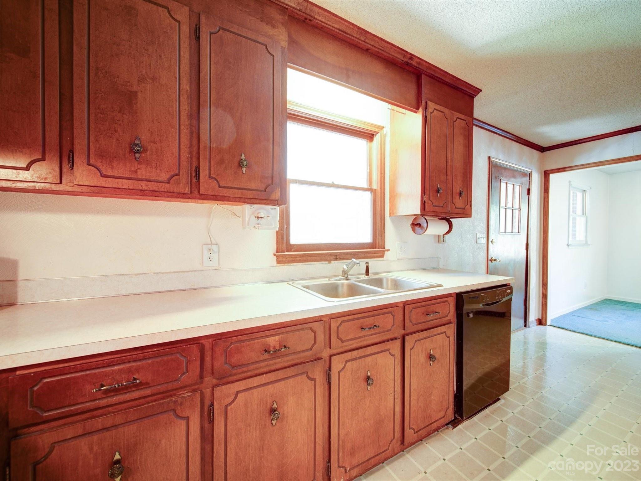 3938 Tater Ridge Road Concord, NC 28025 - Photo 6 of 23 a kitchen with a sink and cabinets