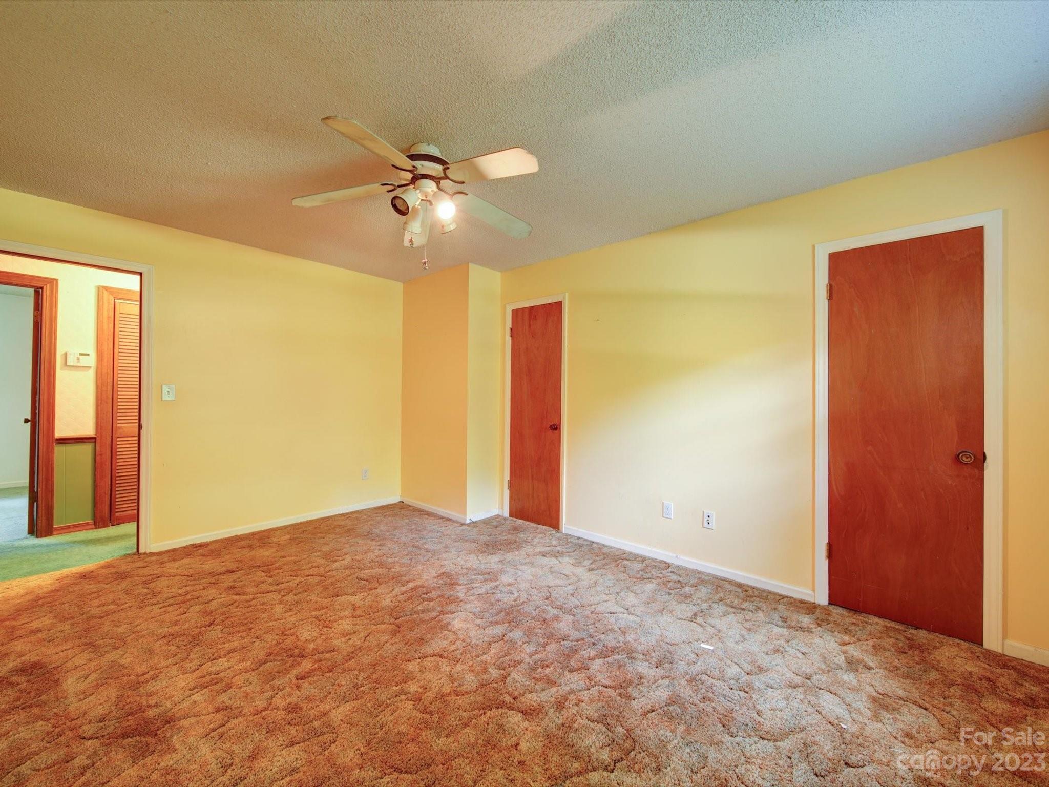 3938 Tater Ridge Road Concord, NC 28025 - Photo 8 of 23 an empty room with a ceiling fan and a window