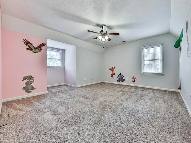 a spacious bathroom with a double vanity sink and a mirror