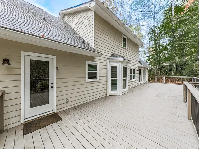 a view of a house with backyard sitting area