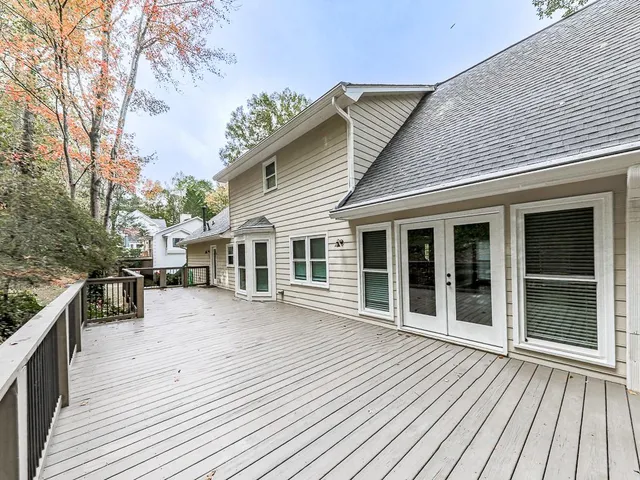 a view of a balcony with trees