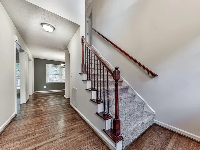 a view of entryway with wooden floor