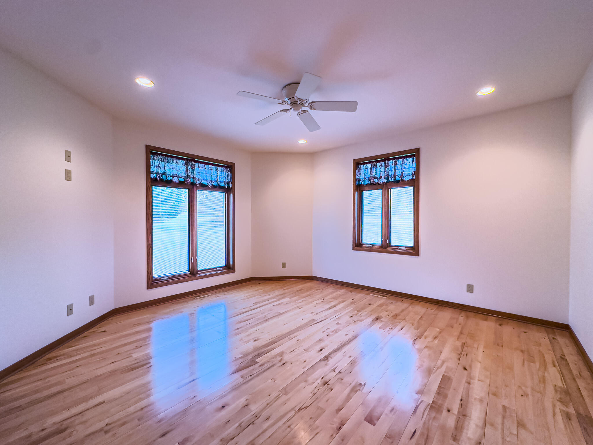 11604 North Granville Road Mequon, WI 53097 - Photo 31 of 49 Hardwood floors and ceiling fan.
