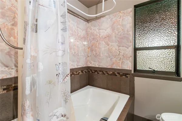 a bathroom with a sink and a shower