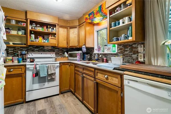 a kitchen with stainless steel appliances granite countertop a stove and a sink