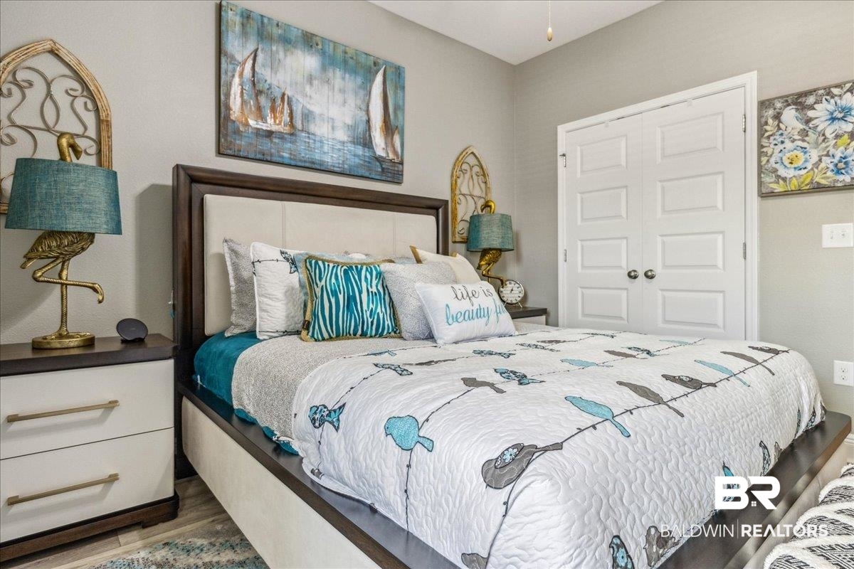 7022 Rocky Rd Loop Gulf Shores, AL 36542 - Photo 31 of 59 Bedroom featuring wood finished floors