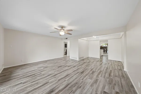 a view of hallway with wooden floor