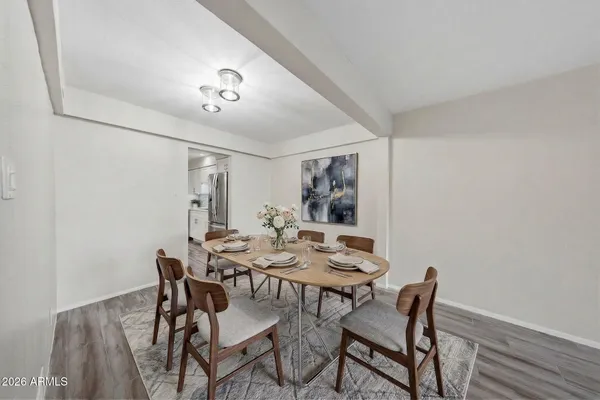 a kitchen with a sink a counter top space stainless steel appliances and cabinets