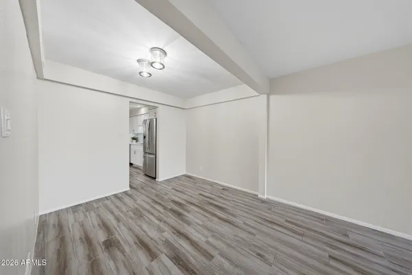 a kitchen with stainless steel appliances a stove a microwave and a refrigerator