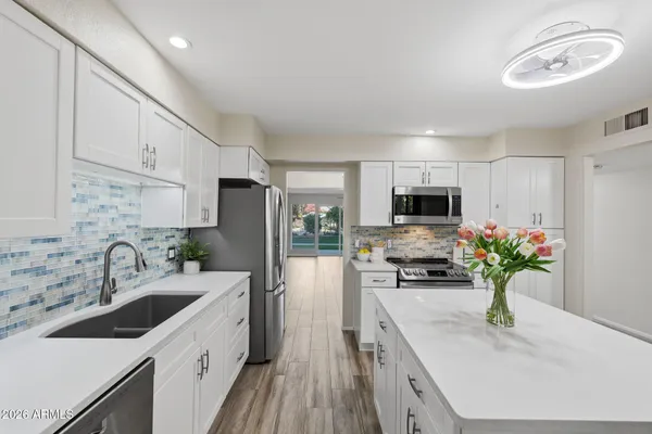 a bathroom with a sink a washer and dryer