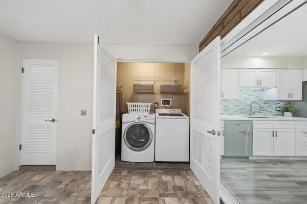 a view of hallway with stairs and a closet