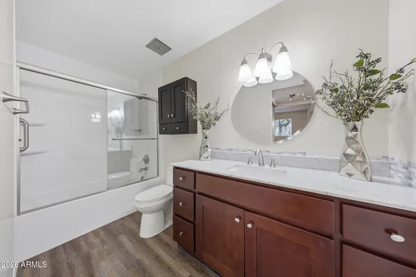 a bathroom with a sink and mirror
