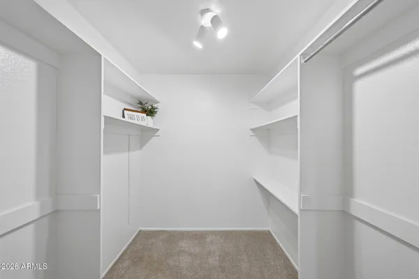 a view of an empty room with glass door