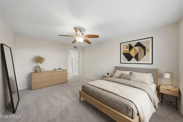 a view of a garden with lawn chairs and a large tree