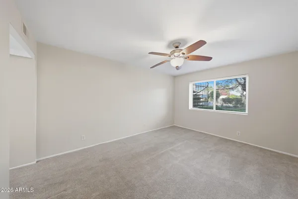 a huge green field with lots of trees