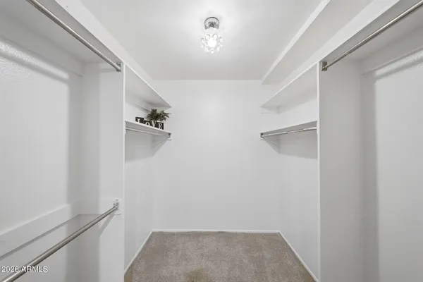 a view of a swimming pool with a table and chairs
