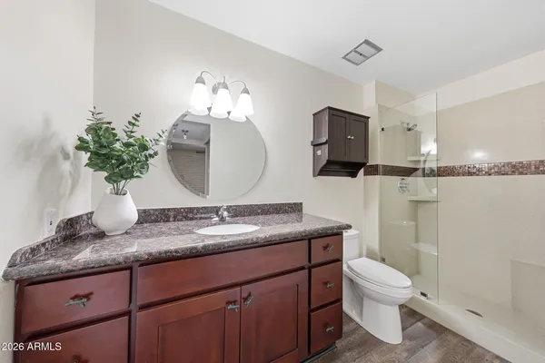 a view of a table and chairs under an umbrella in patio