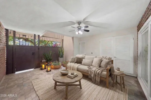 a view of a room with a ceiling fan