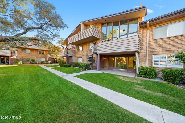 an aerial view of residential houses with outdoor space