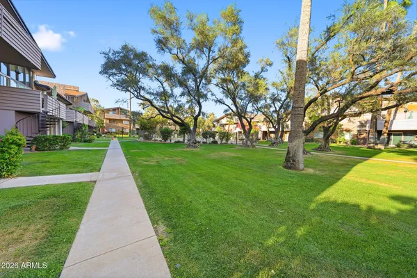 an aerial view of residential houses with city street