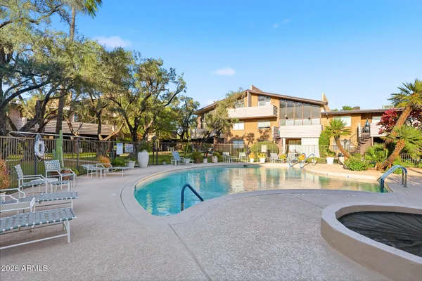 an aerial view of a house with yard swimming pool and outdoor seating