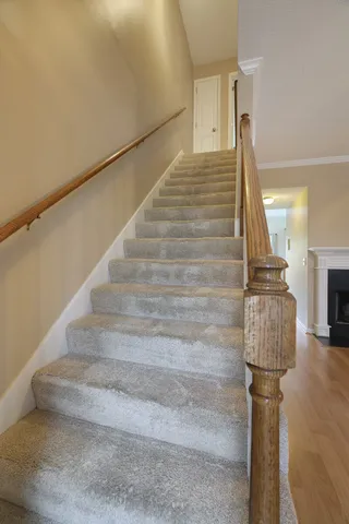 a view of entryway and hall with wooden floor