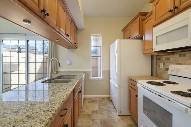 a kitchen that has a cabinets and a stove