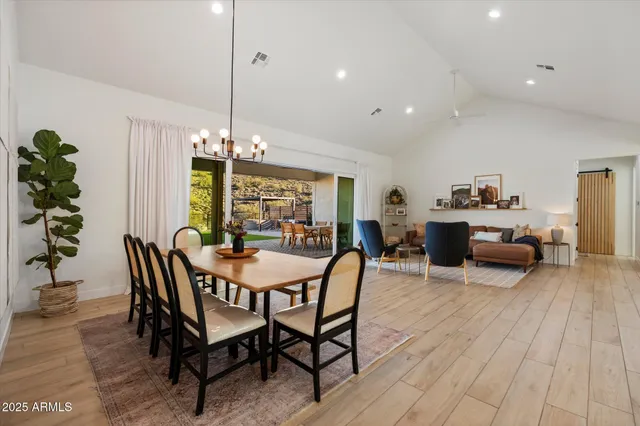 a dining room with furniture and wooden floor