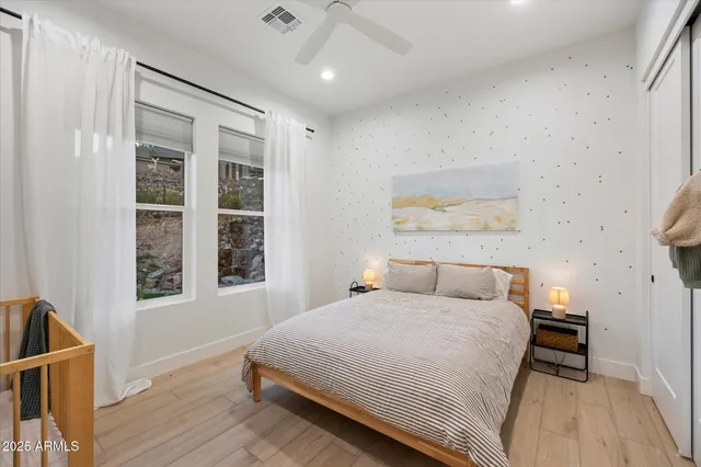 a bedroom with furniture and a window