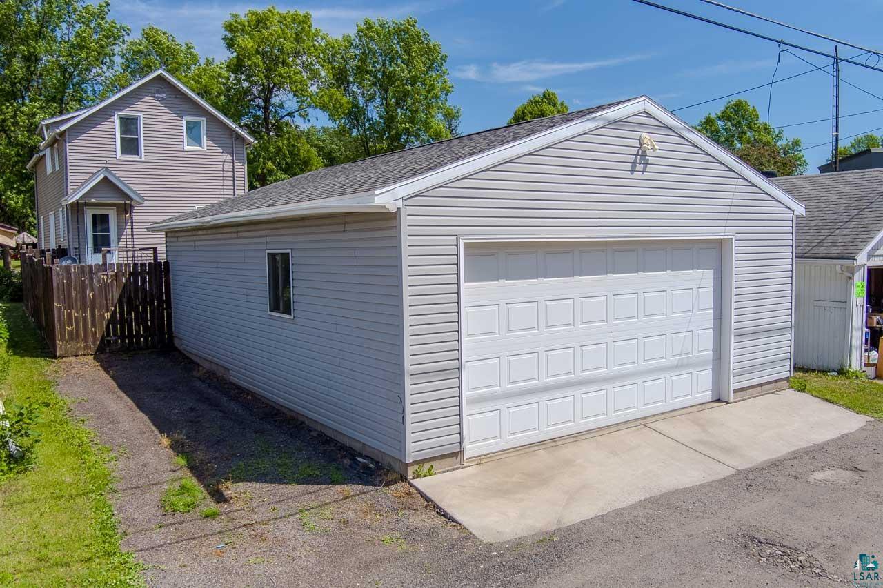 508 10th Street South Virginia, MN 55792 - Photo 2 of 43 Detached garage with horizontal vinyl siding and a white paneled garage door