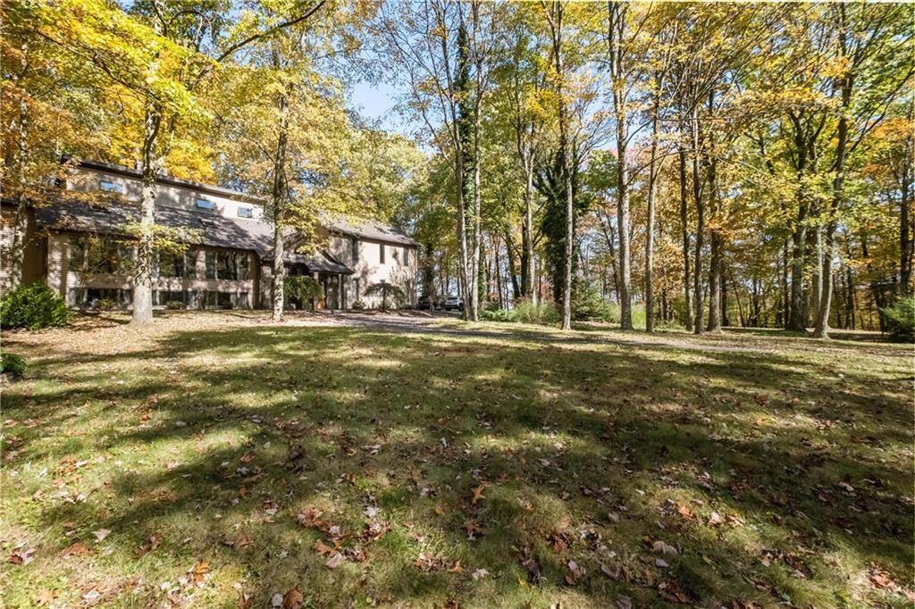 1309 Chestnut Ridge Road Penn Run, PA 15765 - Photo 8 of 45 a front view of residential building with trees