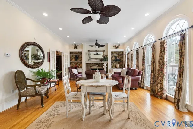 a dining room with furniture and a chandelier