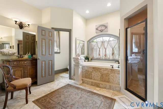 a bathroom with a granite countertop sink a mirror and a shower