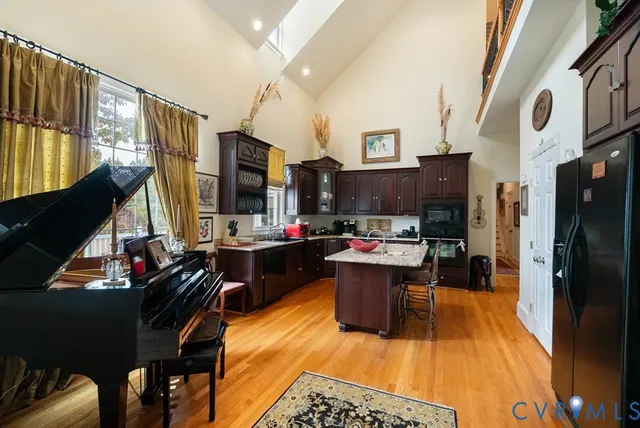a view of a kitchen with kitchen island dining table and chairs