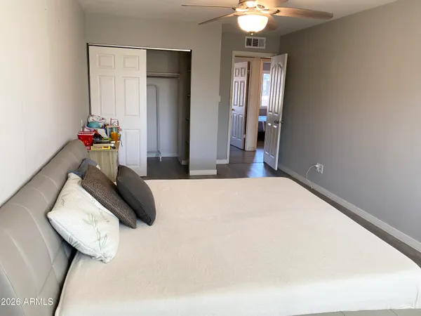 a bedroom with bed and window