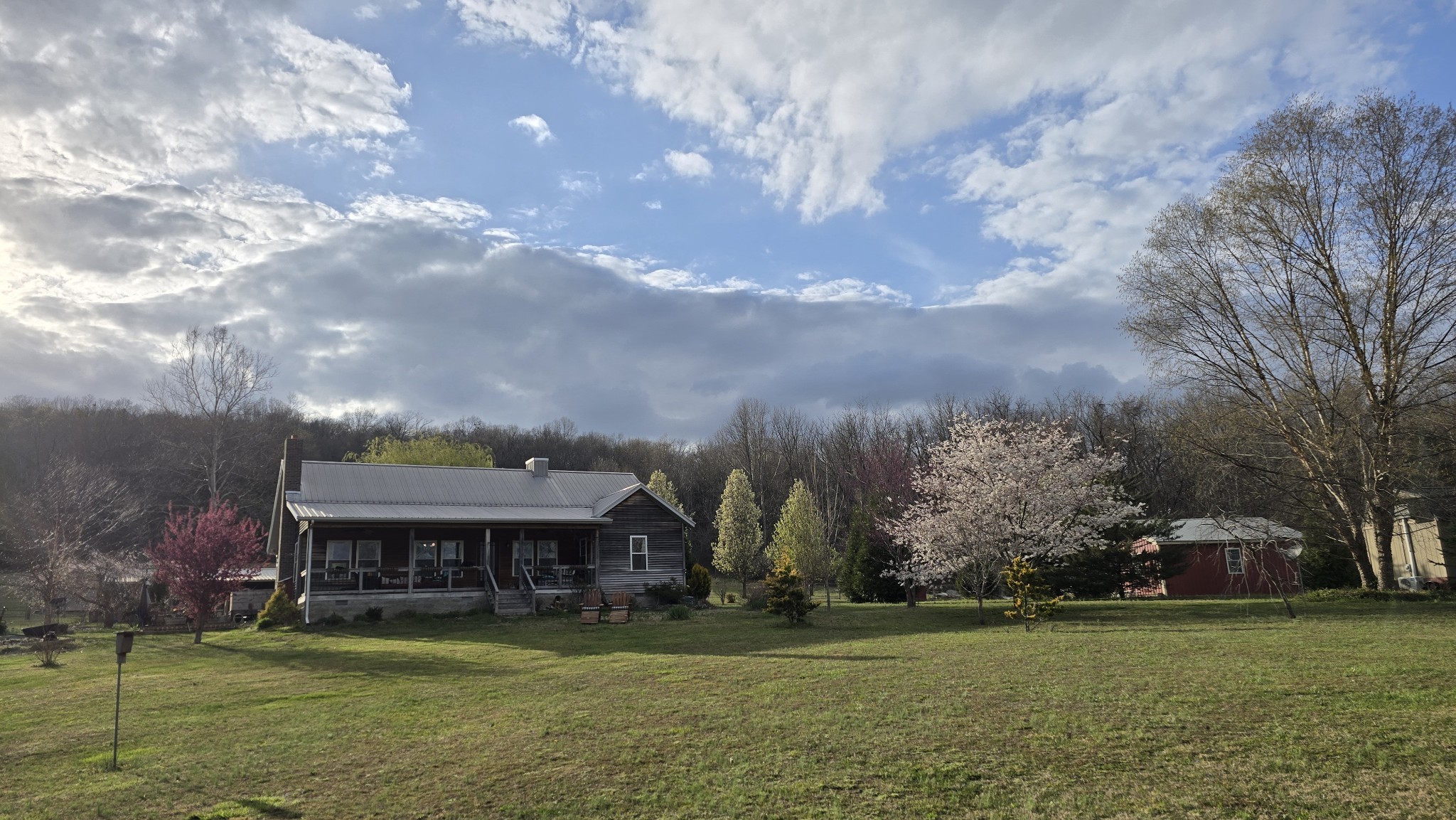 604 Oris Sain Road Morrison, TN 37357 - Photo 5 of 99 a view of a big house with a big yard and large trees