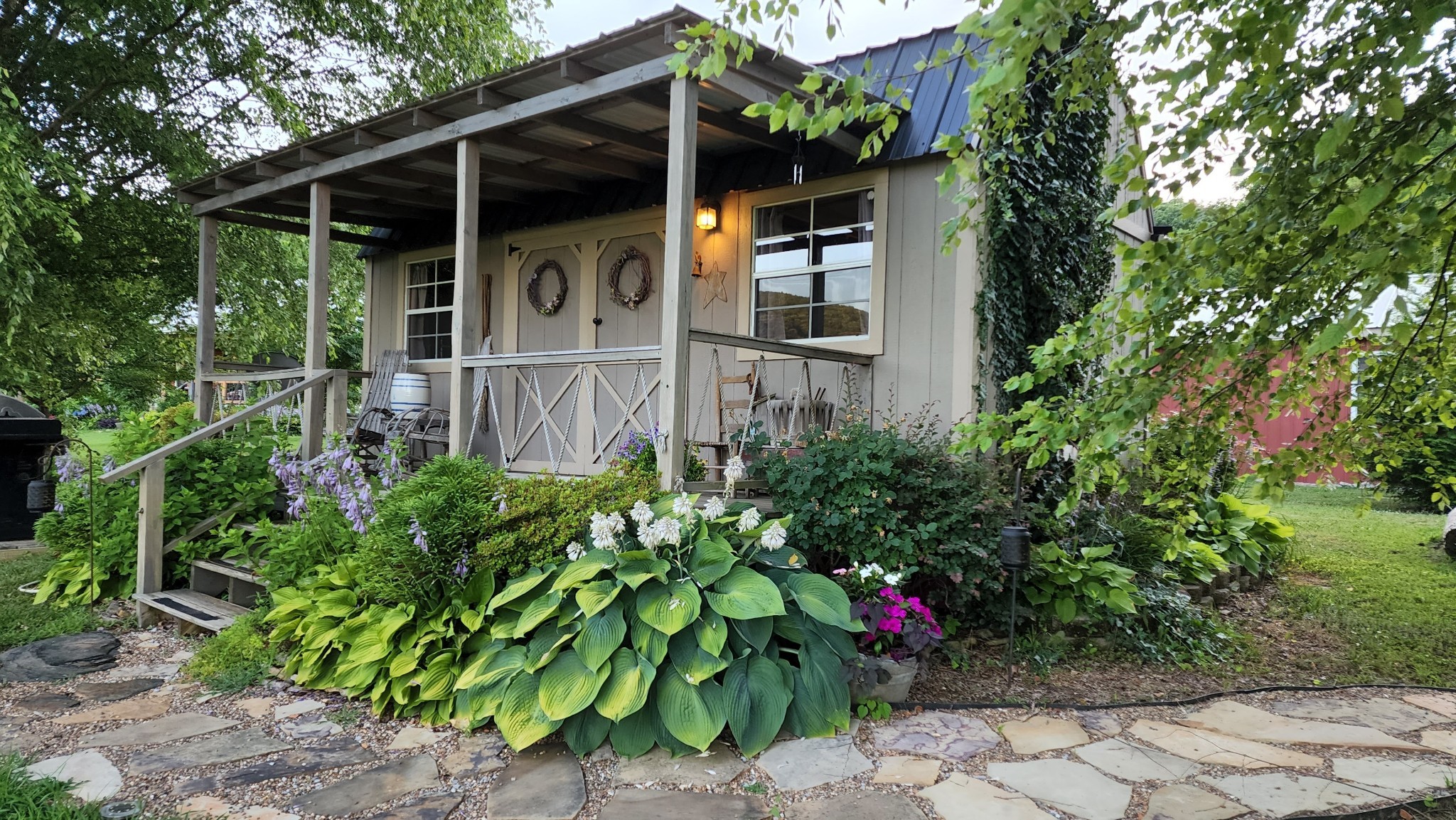 604 Oris Sain Road Morrison, TN 37357 - Photo 64 of 99 a view of a garden with wooden bench
