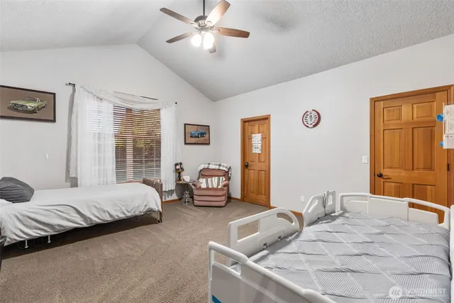 a living room with furniture a rug and a window